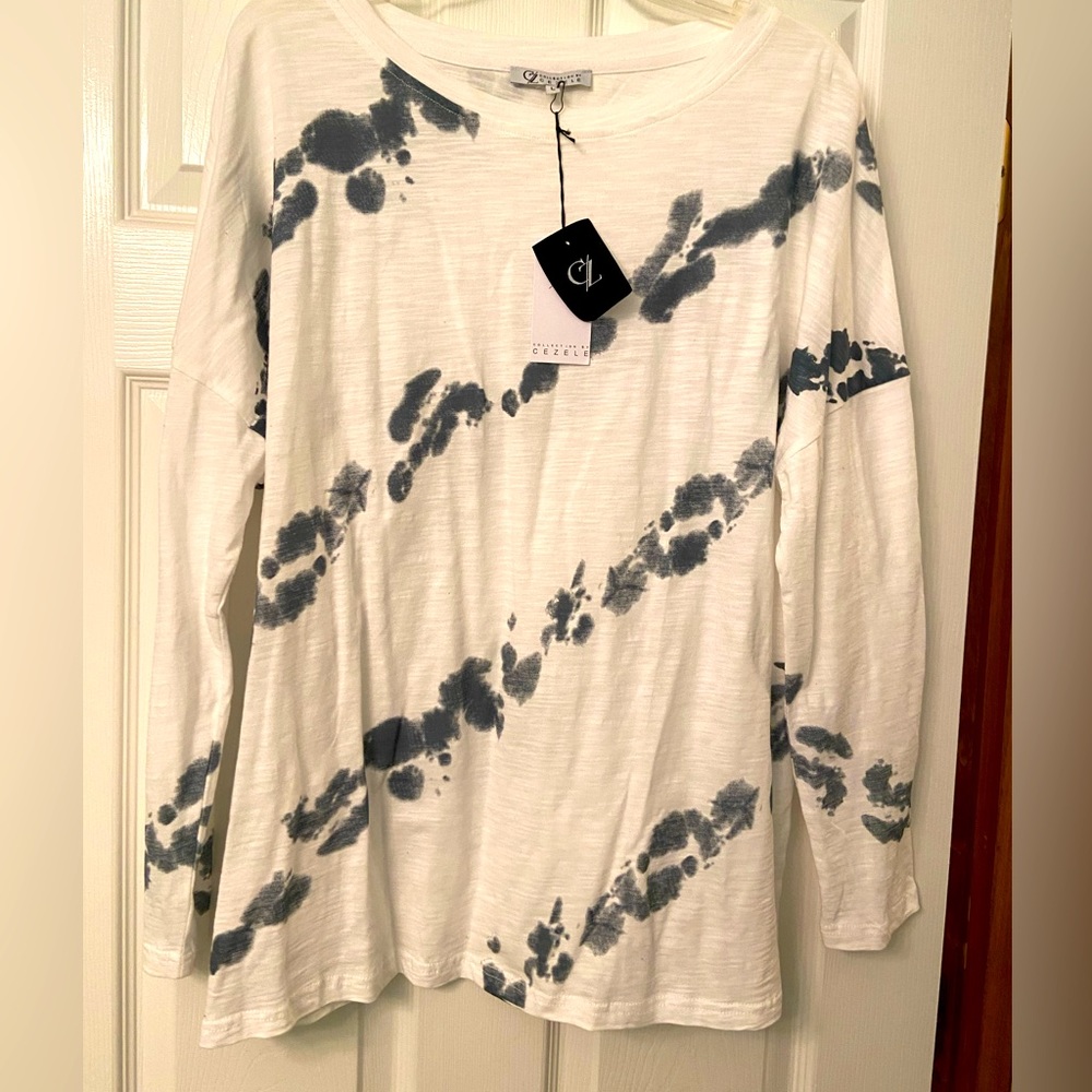 White and grey long sleeved women’s top size large. Brand new